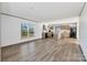 Spacious open-concept living area showcasing wood-look floors and a modern kitchen at 525 Mt. Wesley Church Rd, Hiddenite, NC 28636