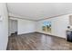 Inviting living room featuring wood-look floors, neutral paint, and plenty of natural light at 525 Mt. Wesley Church Rd, Hiddenite, NC 28636