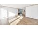 Open-concept living area with wood floors and seamless flow to the kitchen at 525 Mt. Wesley Church Rd, Hiddenite, NC 28636