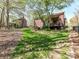 A spacious back yard with green grass, mature trees, and a covered deck at 5301 Greyfriar Ct, Waxhaw, NC 28173