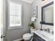 Stylish bathroom with marble countertop and plenty of natural light at 5301 Greyfriar Ct, Waxhaw, NC 28173