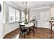 Bright dining room with large windows and stylish light fixture at 5301 Greyfriar Ct, Waxhaw, NC 28173
