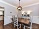 Dining room with wood table, modern chandelier, and neutral decor at 5301 Greyfriar Ct, Waxhaw, NC 28173