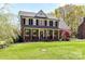Charming two-story brick home with black shutters and a well-manicured front lawn at 5301 Greyfriar Ct, Waxhaw, NC 28173