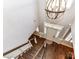 Bright foyer boasts wood floors, a chandelier, and a front door with sidelights and transom windows at 5301 Greyfriar Ct, Waxhaw, NC 28173