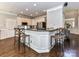 Bright kitchen with granite countertops and breakfast bar with seating at 5301 Greyfriar Ct, Waxhaw, NC 28173
