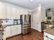 Gourmet kitchen with stainless steel appliances, granite countertops, and white cabinetry at 5301 Greyfriar Ct, Waxhaw, NC 28173