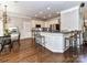 Open kitchen with breakfast bar and granite countertops at 5301 Greyfriar Ct, Waxhaw, NC 28173