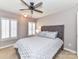 Cozy bedroom with a ceiling fan and shuttered windows at 5301 Greyfriar Ct, Waxhaw, NC 28173