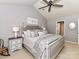 Bright main bedroom featuring a neutral color palette, patterned bedding and vaulted ceiling at 5301 Greyfriar Ct, Waxhaw, NC 28173