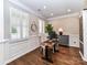 Bright home office with hardwood floors, plantation shutters, and stylish decor at 5301 Greyfriar Ct, Waxhaw, NC 28173