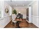 Cozy home office featuring hardwood floors, white trim, and stylish furnishings at 5301 Greyfriar Ct, Waxhaw, NC 28173