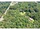 Expansive aerial view of lush, tree-filled acreage with secluded home site offering privacy at 6575 Charlotte Hwy, York, SC 29745