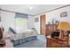 Bright bedroom featuring wood furniture and a sunny window view at 6575 Charlotte Hwy, York, SC 29745