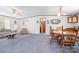 A combined living and dining area featuring a wood dining table, chairs, and comfortable seating, perfect for Gathering gatherings at 6575 Charlotte Hwy, York, SC 29745
