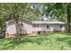Rear exterior of the house with vinyl siding, a large yard and mature trees at 6575 Charlotte Hwy, York, SC 29745
