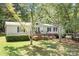 Charming home featuring a covered porch, well-maintained landscaping, and mature trees at 6575 Charlotte Hwy, York, SC 29745