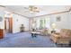 Bright living room with large windows, neutral walls, and comfortable seating at 6575 Charlotte Hwy, York, SC 29745