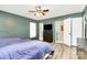 Primary bedroom featuring a ceiling fan, closet, and an ensuite bathroom at 7034 Leaves Ln, Charlotte, NC 28213
