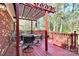 Outdoor deck area with table, chairs, and a pergola at 7034 Leaves Ln, Charlotte, NC 28213