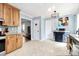 Open concept kitchen featuring granite countertops, wood cabinets and stainless appliances at 7034 Leaves Ln, Charlotte, NC 28213