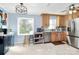 Bright open kitchen with stainless appliances, ample counter space, and natural light at 7034 Leaves Ln, Charlotte, NC 28213