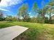 Spacious backyard with lush greenery, perfect for recreation or outdoor activities at 7147 Henderson Valley Ln, Charlotte, NC 28269