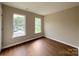 A bright bedroom with two windows that flood the space with natural light at 7147 Henderson Valley Ln, Charlotte, NC 28269