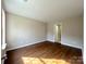 Bright and spacious bedroom boasting wood floors and a serene ambiance at 7147 Henderson Valley Ln, Charlotte, NC 28269