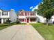 Charming two-story home with a lush lawn and ample driveway space at 7147 Henderson Valley Ln, Charlotte, NC 28269