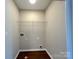 Laundry room with hardwood floors and utility connections at 7147 Henderson Valley Ln, Charlotte, NC 28269