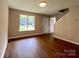 Inviting living area with wood floors, natural light, and seamless transition to other spaces at 7147 Henderson Valley Ln, Charlotte, NC 28269