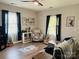 Comfortable living room featuring a ceiling fan, hardwood floors, and ample natural light at 806 Grace St, Kings Mountain, NC 28086