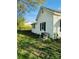 A view of the side yard featuring a well maintained lawn and full grown trees at 806 Grace St, Kings Mountain, NC 28086