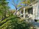 Relaxing covered porch with seating offers views of the well-maintained front lawn at 806 Grace St, Kings Mountain, NC 28086