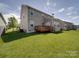 Spacious backyard with a wooden deck, perfect for outdoor entertaining and relaxation at 848 Wingthorn Rose Dr, Gastonia, NC 28056