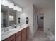 Bathroom featuring a double sink vanity and an enclosed shower at 848 Wingthorn Rose Dr, Gastonia, NC 28056