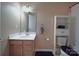 Neutral bathroom featuring a white vanity, sink, and storage cabinet at 848 Wingthorn Rose Dr, Gastonia, NC 28056