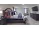 A spacious main bedroom featuring tray ceilings, neutral walls, carpet flooring, and great natural light at 848 Wingthorn Rose Dr, Gastonia, NC 28056