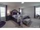 Spacious primary bedroom with lots of natural light and stylish decor at 848 Wingthorn Rose Dr, Gastonia, NC 28056