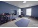 Home gym featuring an exercise mat, weights, and mirrors at 848 Wingthorn Rose Dr, Gastonia, NC 28056