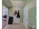 Hallway with green walls and two white doors at 848 Wingthorn Rose Dr, Gastonia, NC 28056