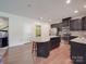 Open kitchen featuring stainless steel appliances, granite counters and wood floors at 848 Wingthorn Rose Dr, Gastonia, NC 28056