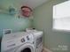 Laundry room featuring newer Samsung washer and dryer units at 848 Wingthorn Rose Dr, Gastonia, NC 28056