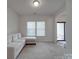 Bright and airy living room features a modern sofa and ample natural light at 848 Wingthorn Rose Dr, Gastonia, NC 28056