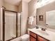 Bathroom featuring a glass shower door and a wood vanity at 9622 Harvest Pond Nw Dr, Concord, NC 28027