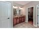 Bathroom featuring double sinks and a tiled floor at 9622 Harvest Pond Nw Dr, Concord, NC 28027