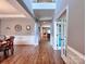 Elegant foyer with wood floors, soaring ceilings, and an open floor plan, creating a grand entrance at 9622 Harvest Pond Nw Dr, Concord, NC 28027