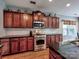Modern kitchen featuring stainless steel oven, light backsplash and dark granite countertops at 9622 Harvest Pond Nw Dr, Concord, NC 28027