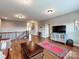 Open living room with hardwood floors and staircase at 9622 Harvest Pond Nw Dr, Concord, NC 28027